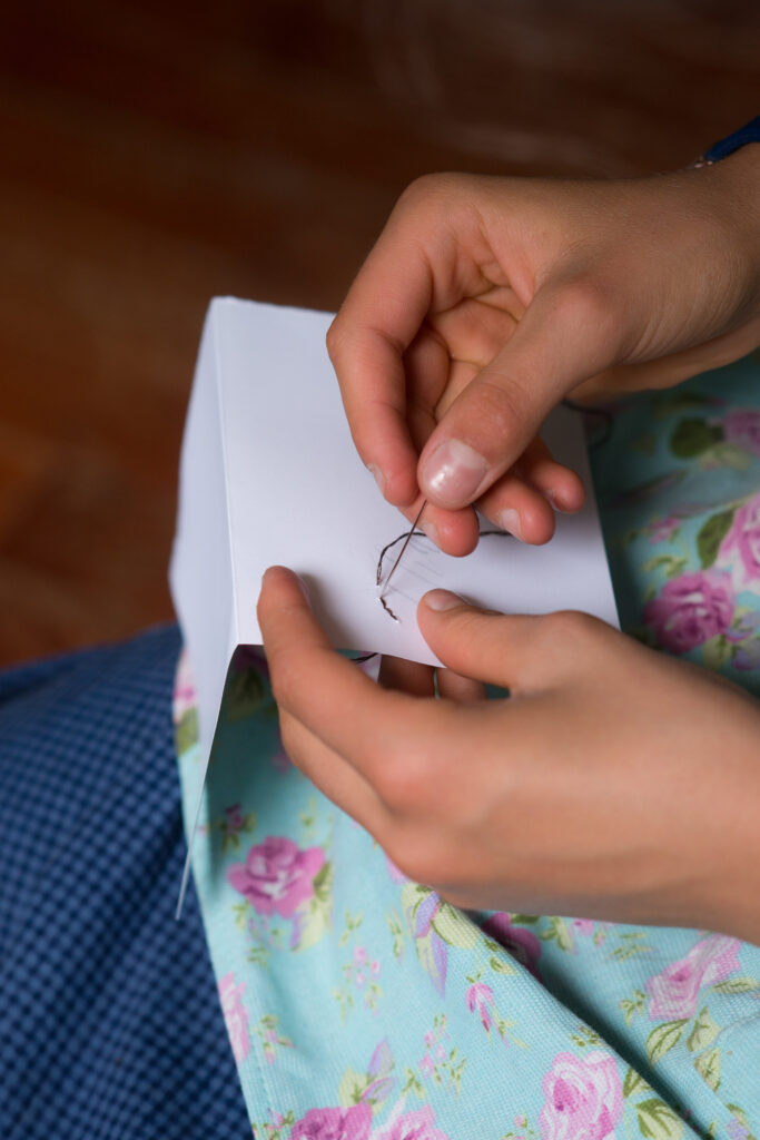 doing a back stitch embroidery stitch on a card